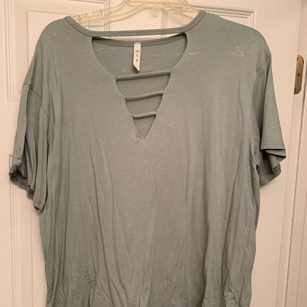 Green T-shirt with vneck with cut outs.